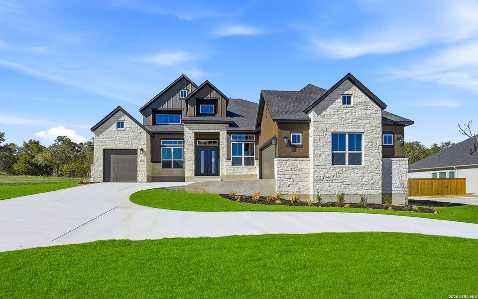 Front exterior of a new home in Heimer Estates at Garden Ridge, San Antonio, TX, highlighting curb appeal (Image 26).