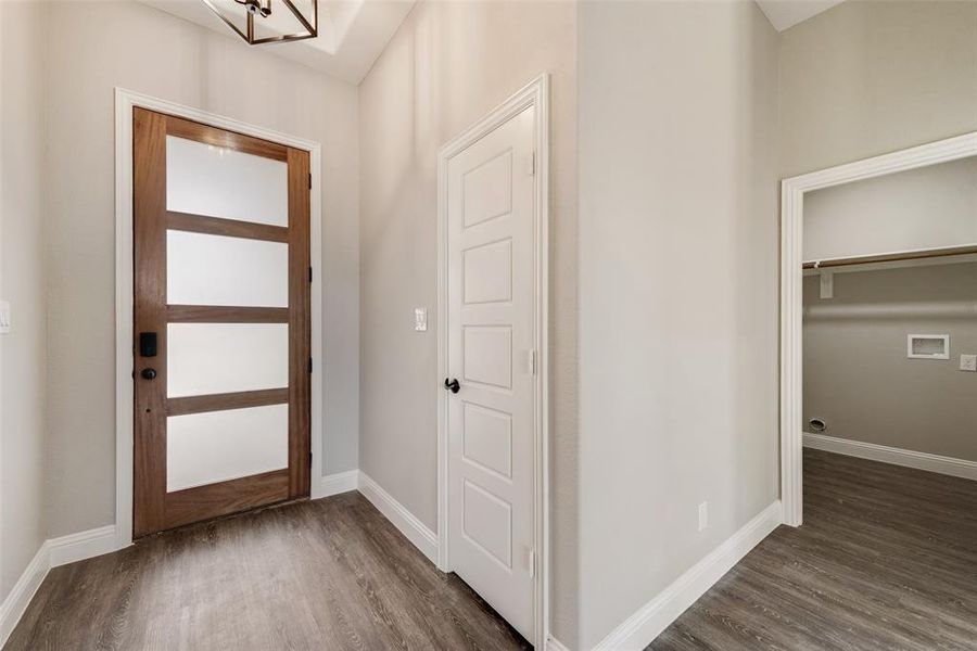 Foyer entrance featuring dark hardwood / wood-style flooring