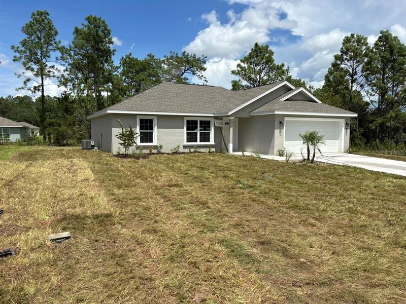 Front exterior of a new home in , Dunnellon, FL, highlighting curb appeal (Image 1). Front exterior of a new home in , Dunnellon, FL, highlighting curb appeal (Image 1).