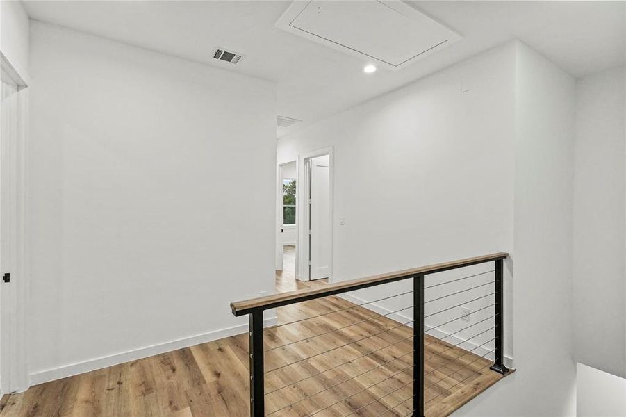 Corridor featuring light hardwood / wood-style floors