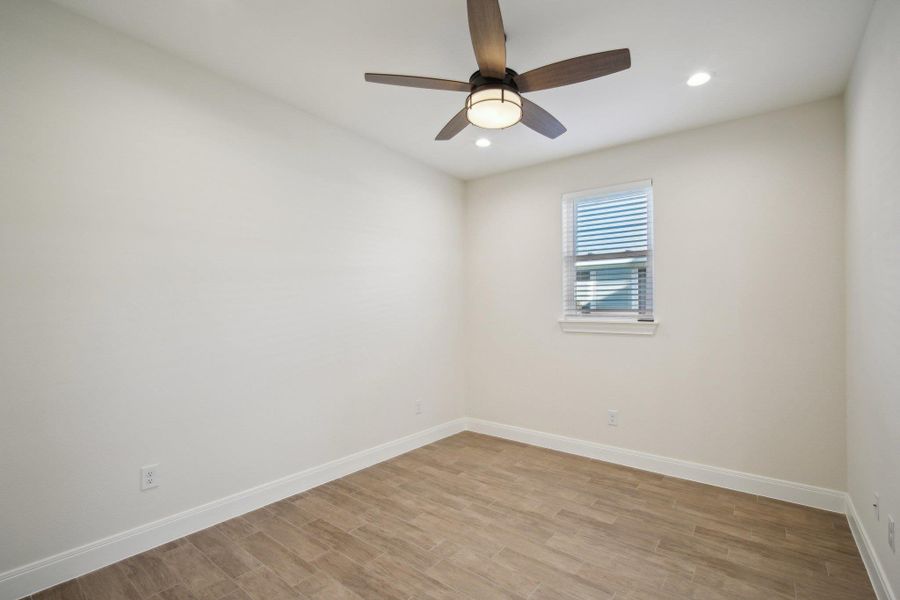 Primary Bedroom with light wood finished floors, baseboards, ceiling fan, and recessed lighting Primary Bedroom with light wood finished floors, baseboards, ceiling fan, and recessed lighting