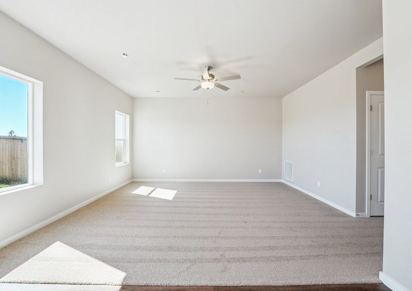 The family room is a spacious with a ceiling fan. The family room is a spacious with a ceiling fan.