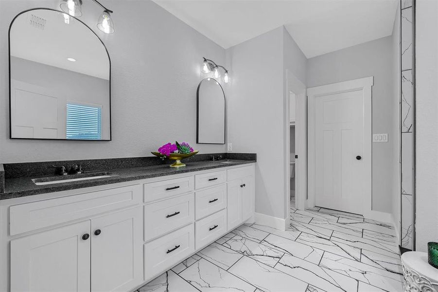 Bathroom with vanity and toilet