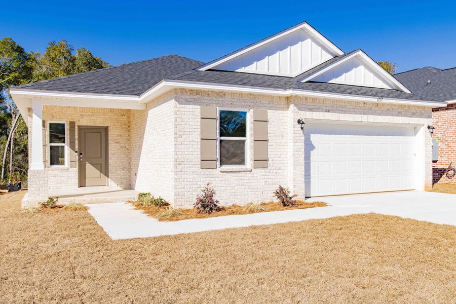 Front exterior of a new home in Coastal Communities, Edgewater, FL, highlighting curb appeal (Image 29).