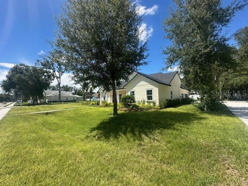 Front exterior of a new home in , Lake Helen, FL, highlighting curb appeal (Image 23).