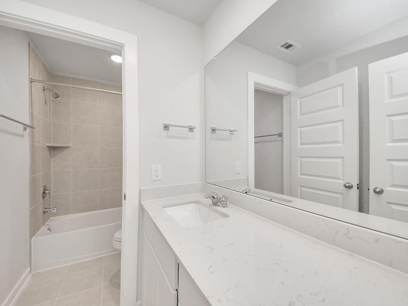 Furnished interior view inside a new home in Caney Creek Place, Conroe (Image 12).