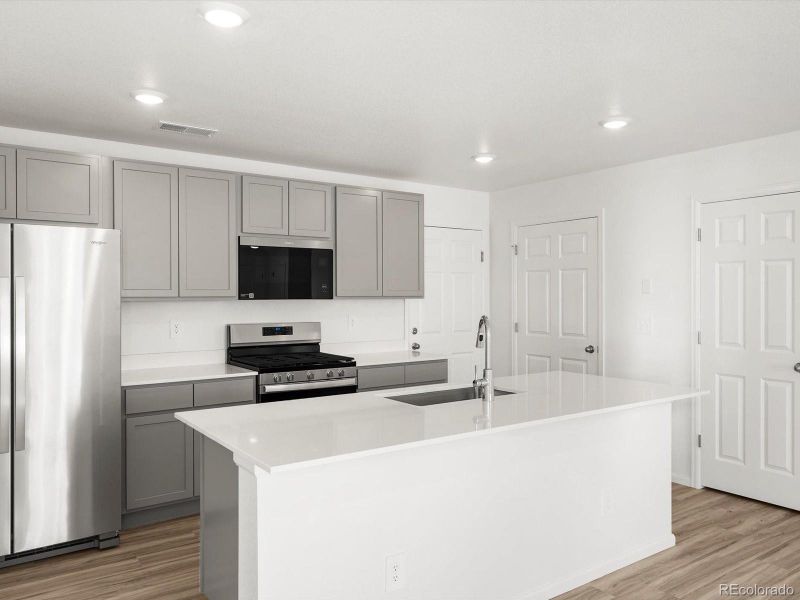 Furnished interior view inside a new home in Skyview at High Point, Aurora (Image 7).