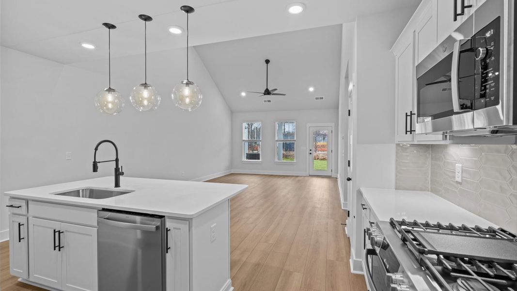 Accomplished kitchen layout with a compact island, perfect for prep and casual dining