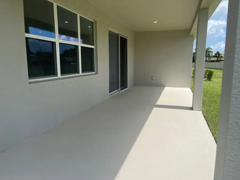 Exterior details and patio area of a home in Country Club Estates, Palm Bay (Image 3).