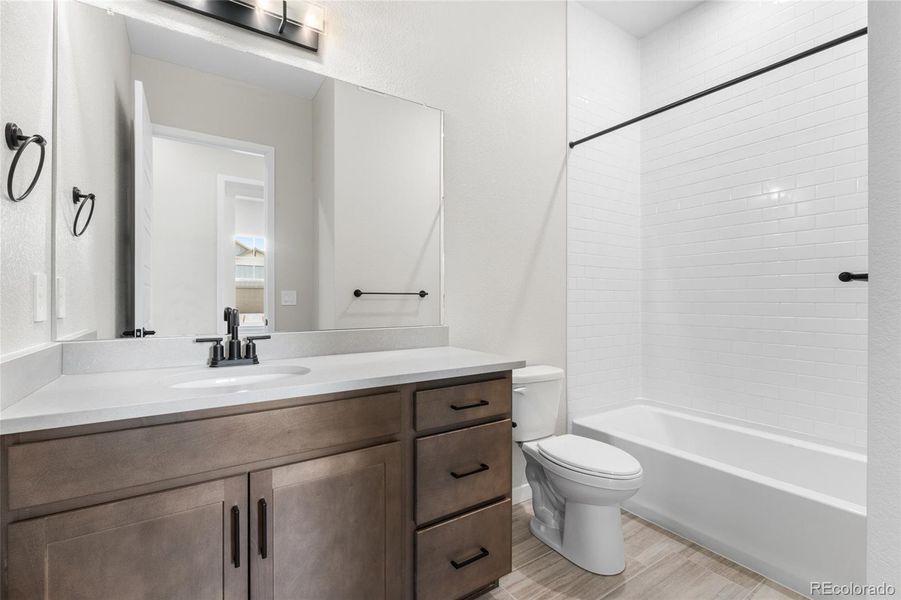 Furnished interior view inside a new home in Hilltop at Inspiration, Aurora (Image 11).