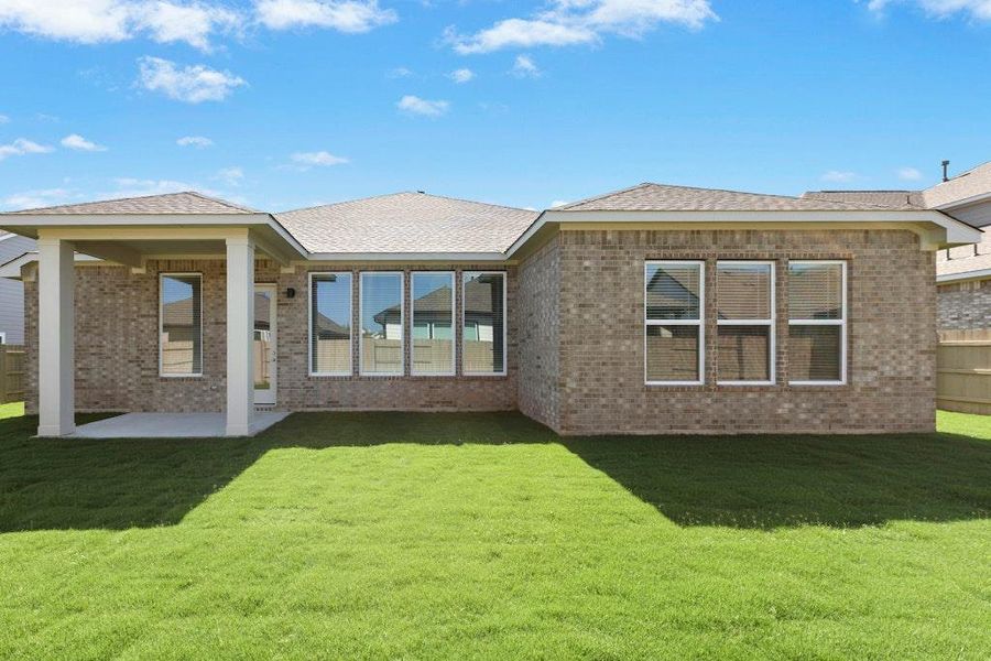 Front exterior of a new home in The Colony, Bastrop, TX, highlighting curb appeal (Image 22).
