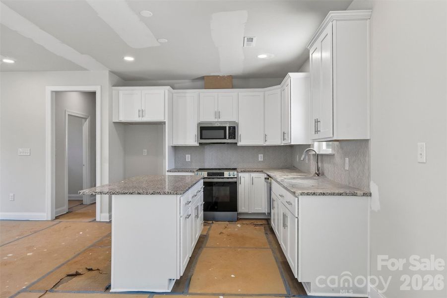 Furnished interior view inside a new home in , Statesville (Image 6).