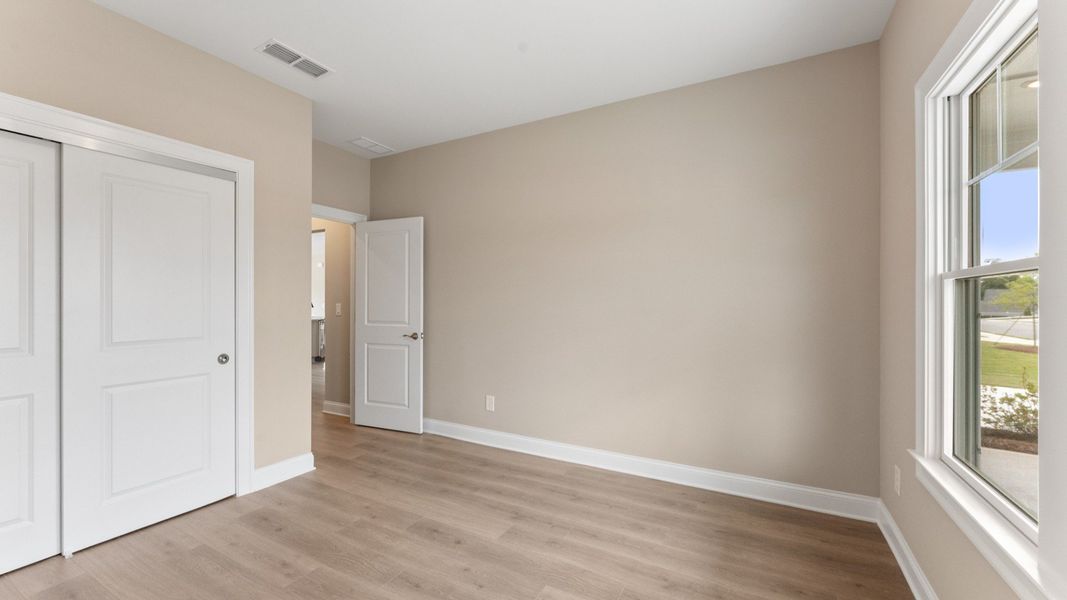 Spacious, unfurnished interior of a new home in The Courtyards at Bailey Farms, Dacula (Image 27).