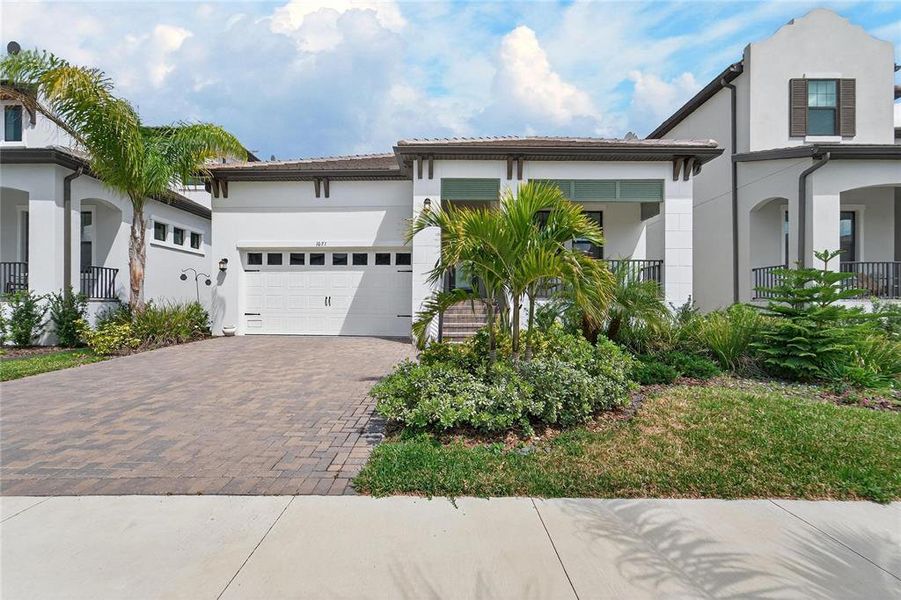 Front exterior of a new home in SouthShore Yacht Club, Ruskin, FL, highlighting curb appeal (Image 27). Front exterior of a new home in SouthShore Yacht Club, Ruskin, FL, highlighting curb appeal (Image 27).