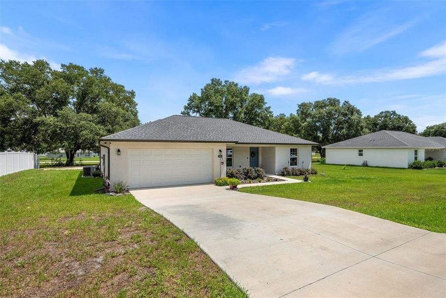 Front exterior of a new home in Citra Highland, Citra, FL, highlighting curb appeal (Image 2). Front exterior of a new home in Citra Highland, Citra, FL, highlighting curb appeal (Image 2).