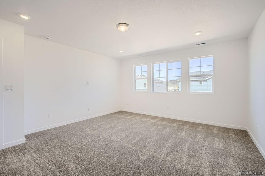 Spacious, unfurnished interior of a new home in Riano Ridge: The Monarch Collection, Loveland (Image 9).