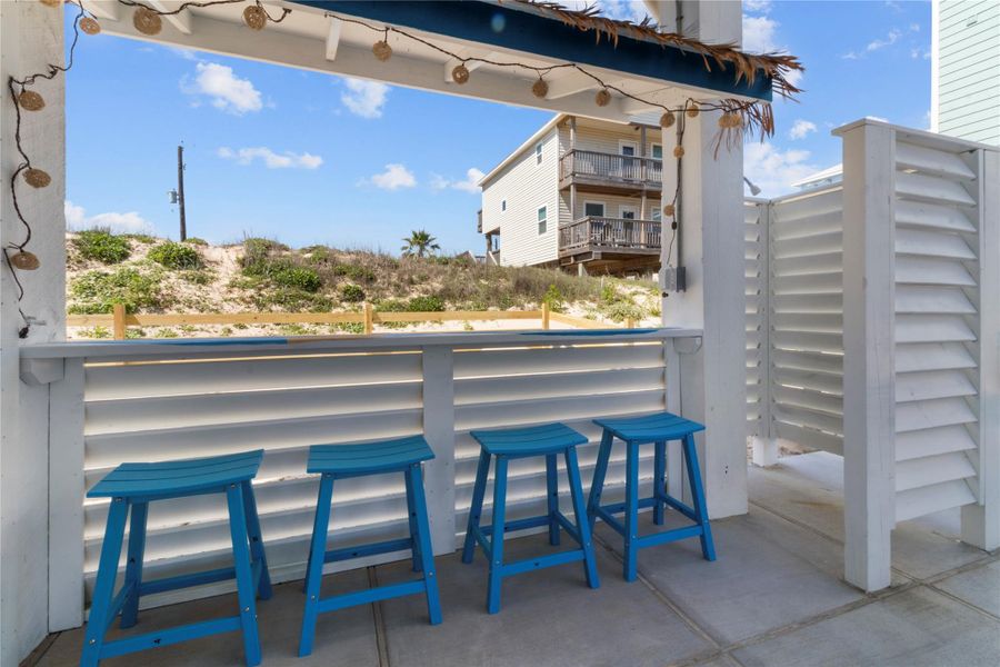 Tiki Bar. Bar top is painted by an EXCLUSIVE local artist! Also, note the outdoor shower is on the right.