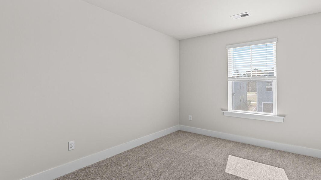 Spacious, unfurnished interior of a new home in The Haven at Indigo Preserve, Leland (Image 31).