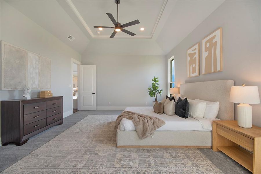 Bedroom featuring a tray ceiling, light colored carpet, a ceiling fan, and recessed lighting Bedroom featuring a tray ceiling, light colored carpet, a ceiling fan, and recessed lighting