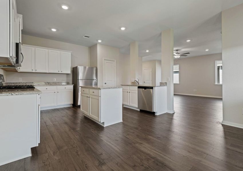 Kitchen with white countertops and granite countertops