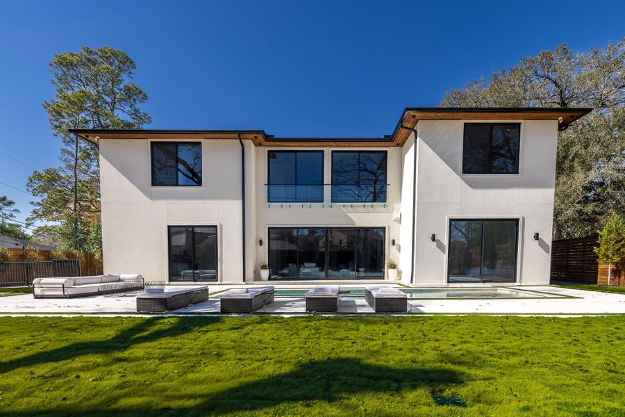 Rear elevation showcasing indoor–outdoor living design. Rear elevation showcasing indoor–outdoor living design.