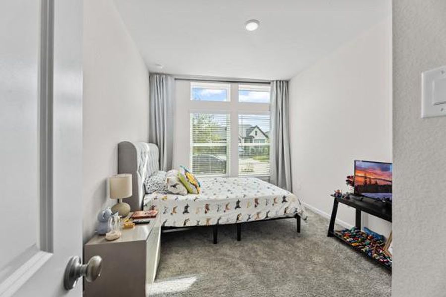 The front bedroom is relaxing and well lit. The front bedroom is relaxing and well lit.