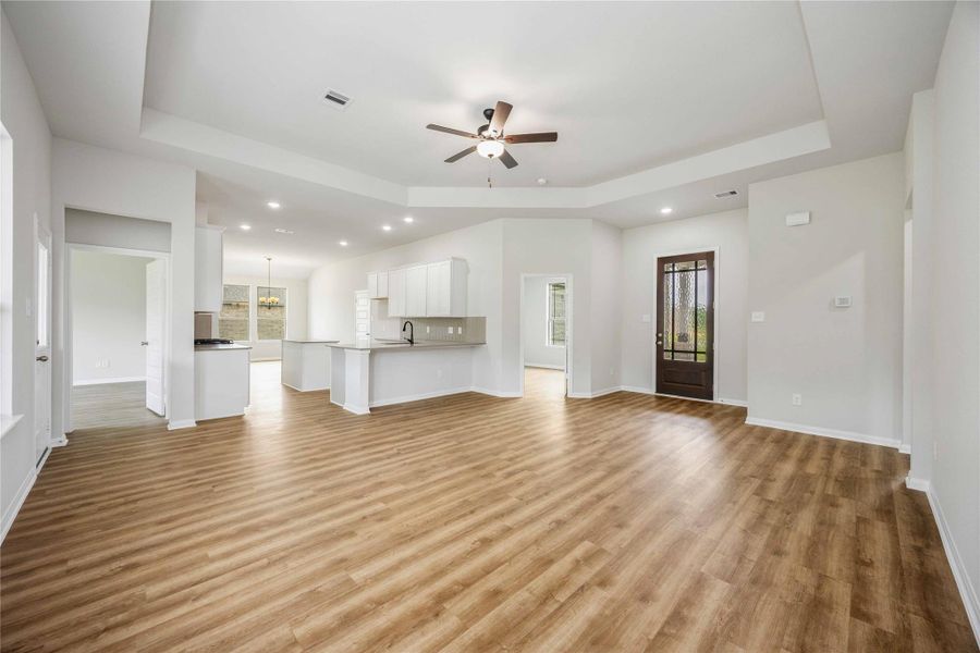 The open-concept floorplan seamlessly connects the family room, kitchen, and dining areas, making this floorplan perfect for family gatherings and entertaining. The open-concept floorplan seamlessly connects the family room, kitchen, and dining areas, making this floorplan perfect for family gatherings and entertaining.