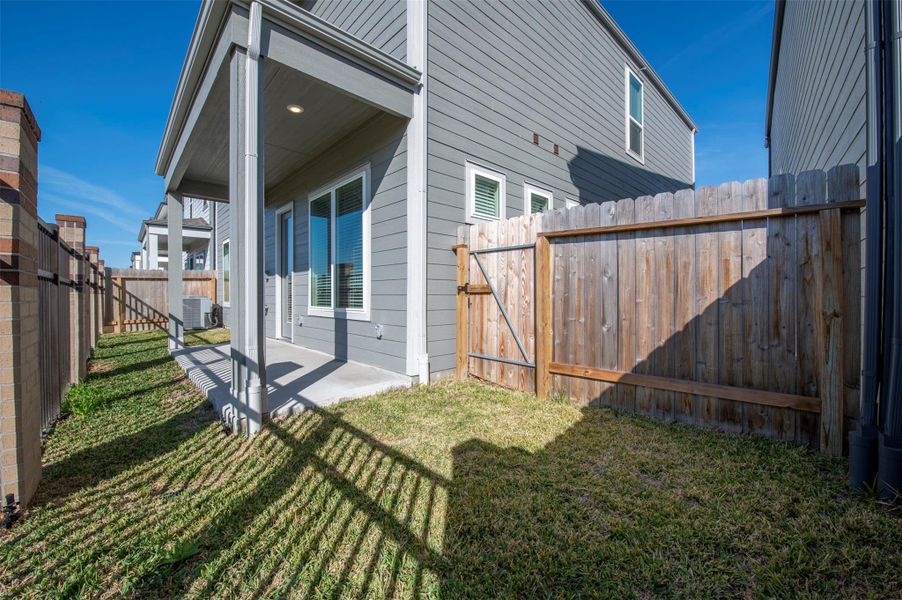 Exterior details and patio area of a home in Spring Brook Village - Luxe Series, Houston (Image 3).