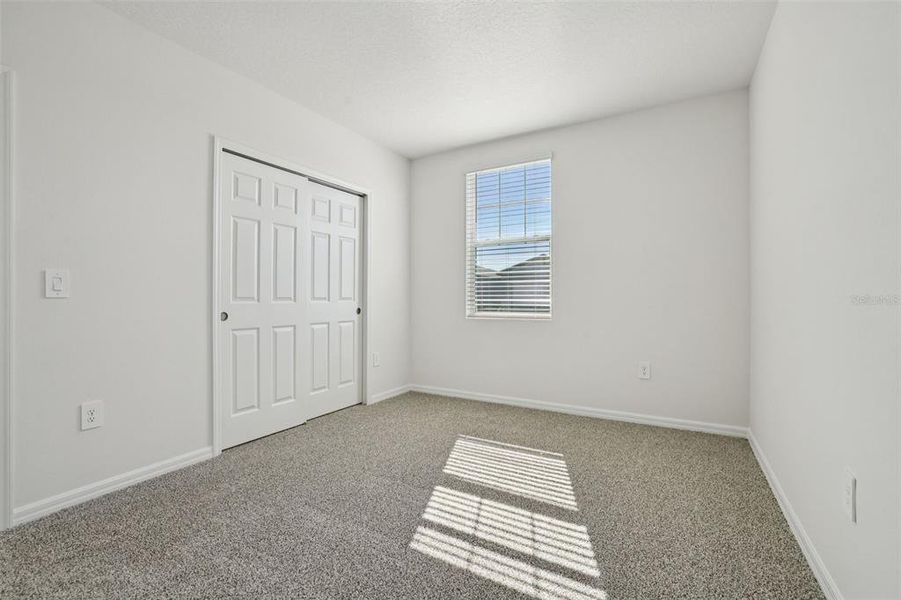 Spacious, unfurnished interior of a new home in Lake Deer Estates - Signature Series, Poinciana (Image 22).