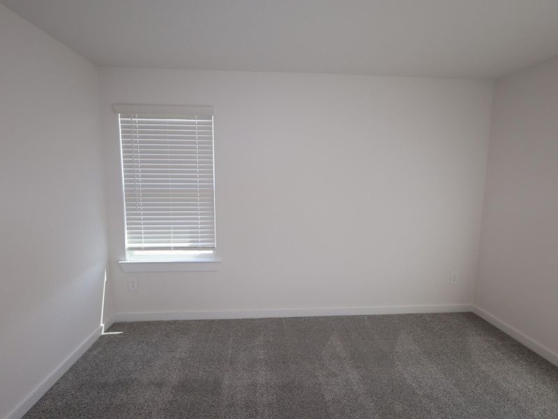 Spacious, unfurnished interior of a new home in Pinewood at Grand Texas, New Caney (Image 30).