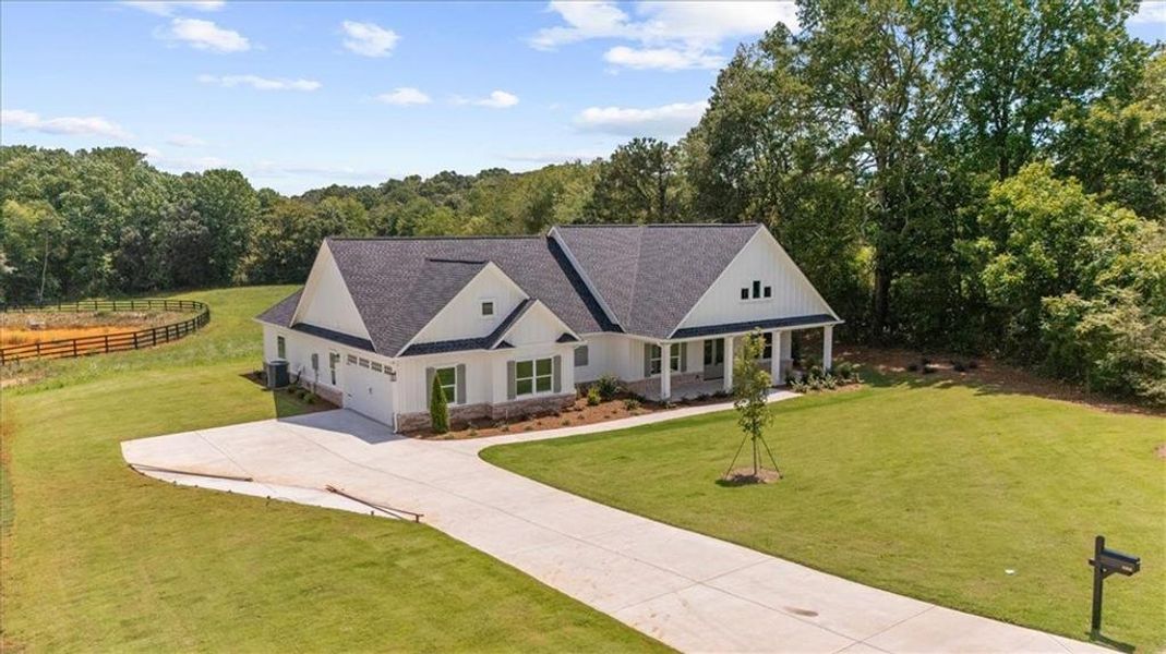 Front exterior of a new home in , Cumming, GA, highlighting curb appeal (Image 32).