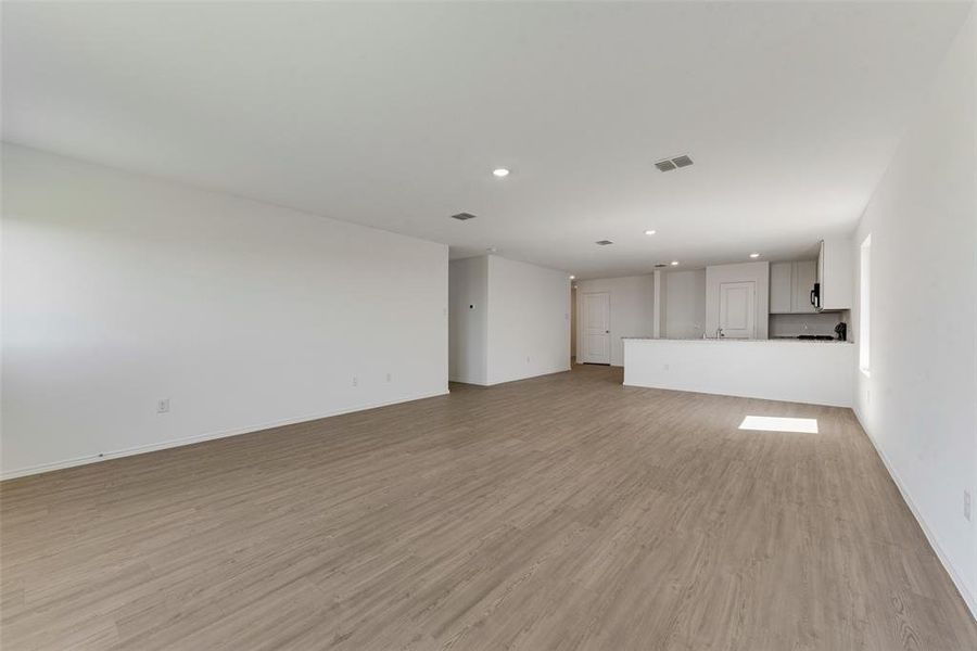 Unfurnished living room with light hardwood / wood-style flooring