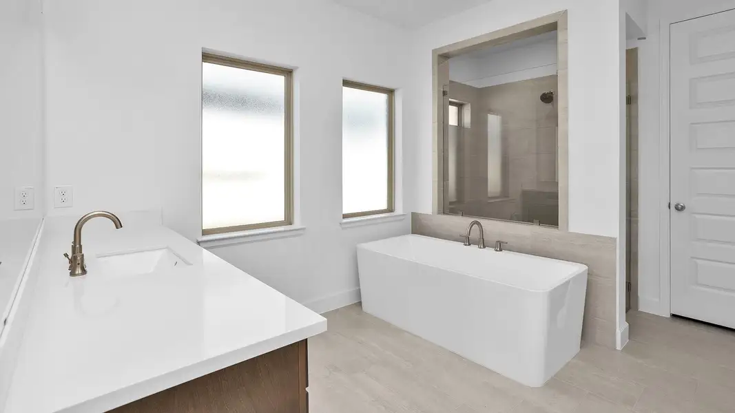 Furnished interior view inside a new home in Grand Central Park 45', Conroe (Image 6).