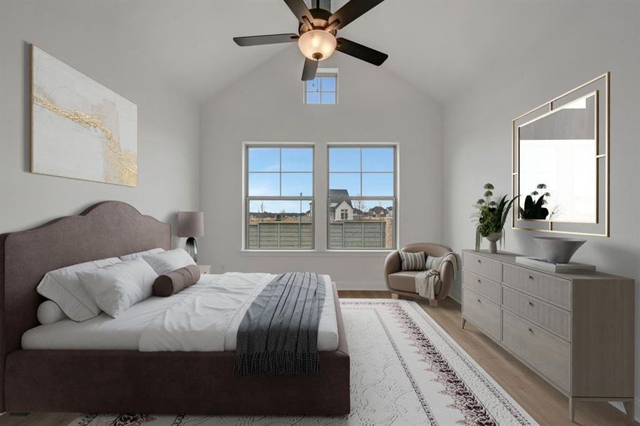 Bedroom with lofted ceiling, a ceiling fan, and wood finished floors