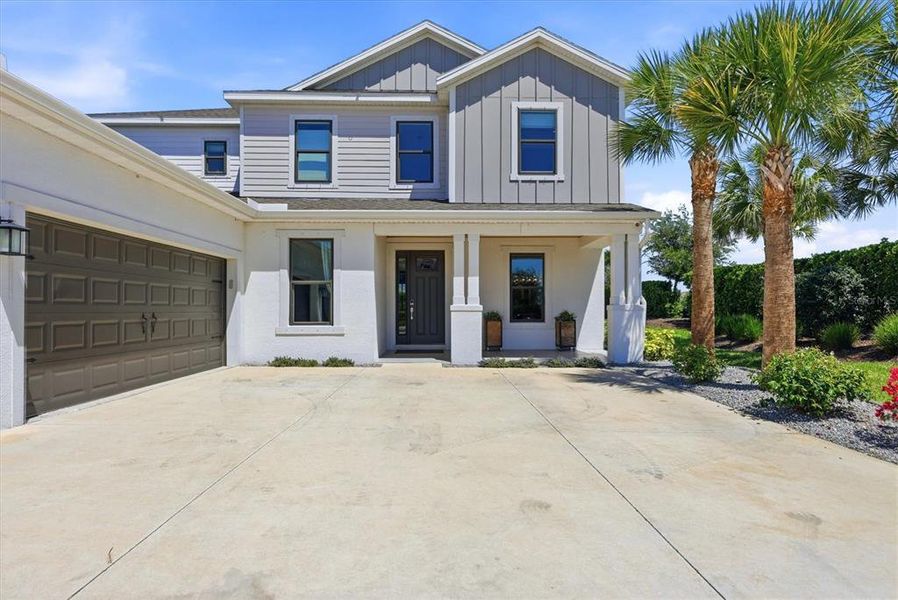 Front exterior of a new home in , Sarasota, FL, highlighting curb appeal (Image 23).