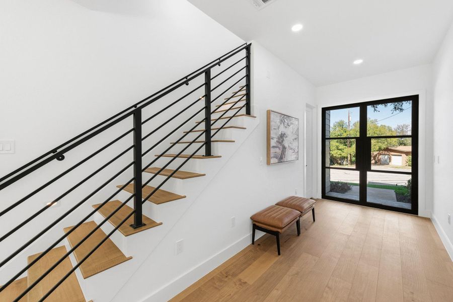Wonderful entry featuring recessed lighting and wood finished floors