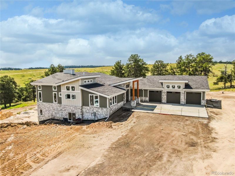 Front exterior of a new home in , Kiowa, CO, highlighting curb appeal (Image 1).
