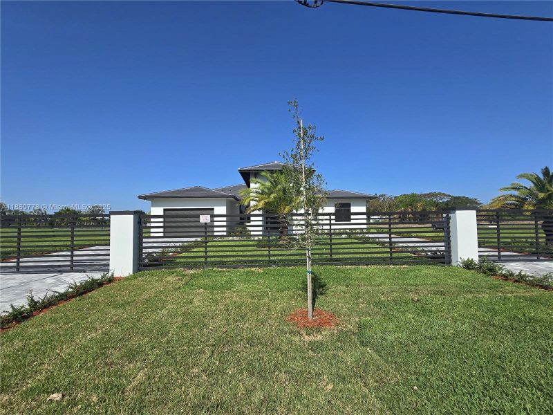 Front exterior of a new home in , Homestead, FL, highlighting curb appeal (Image 24).