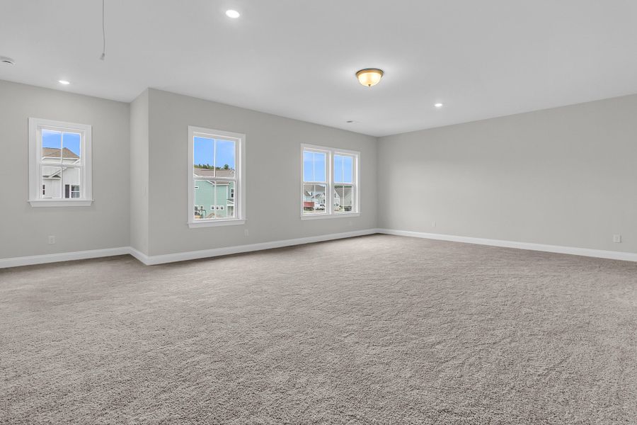 Spacious, unfurnished interior of a new home in Tidewater at Lakes of Cane Bay, Summerville (Image 41).