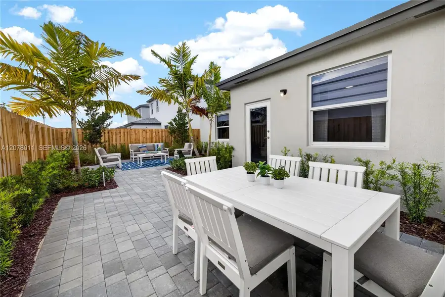 Exterior details and patio area of a home in Acacia Groves, Miami (Image 2). Exterior details and patio area of a home in Acacia Groves, Miami (Image 2).