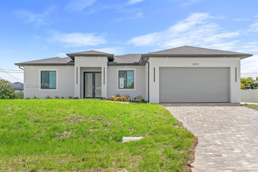Front exterior of a new home in , Cape Coral, FL, highlighting curb appeal (Image 19).