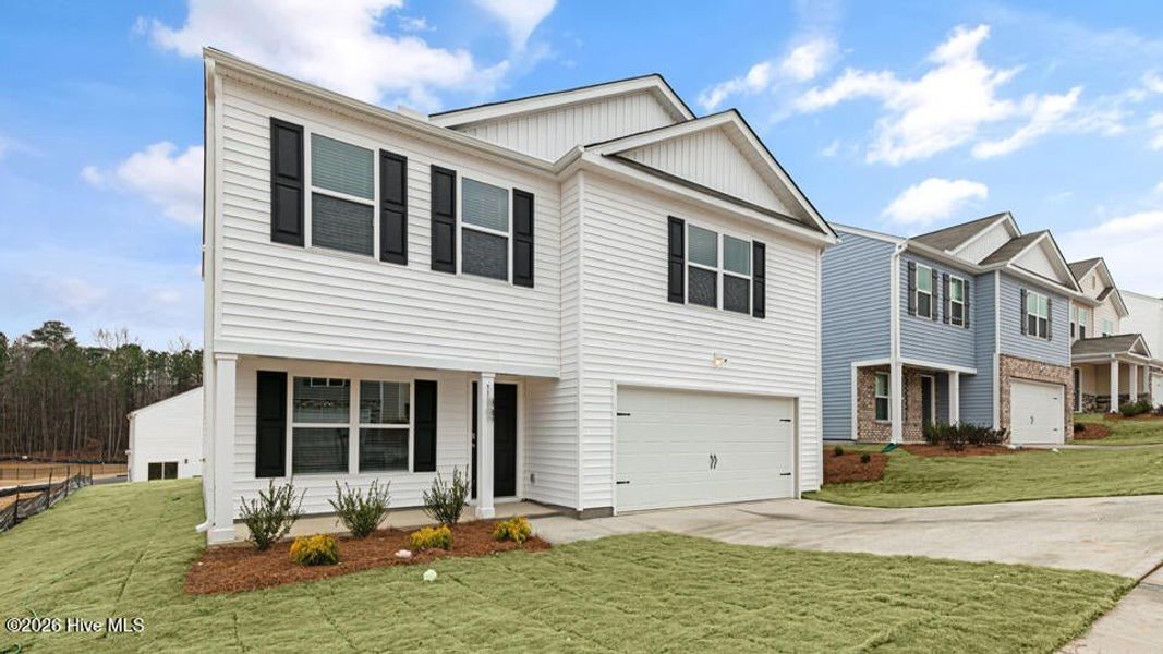 Front exterior of a new home in Bynum Farms, Farmville, NC, highlighting curb appeal (Image 2). Front exterior of a new home in Bynum Farms, Farmville, NC, highlighting curb appeal (Image 2).