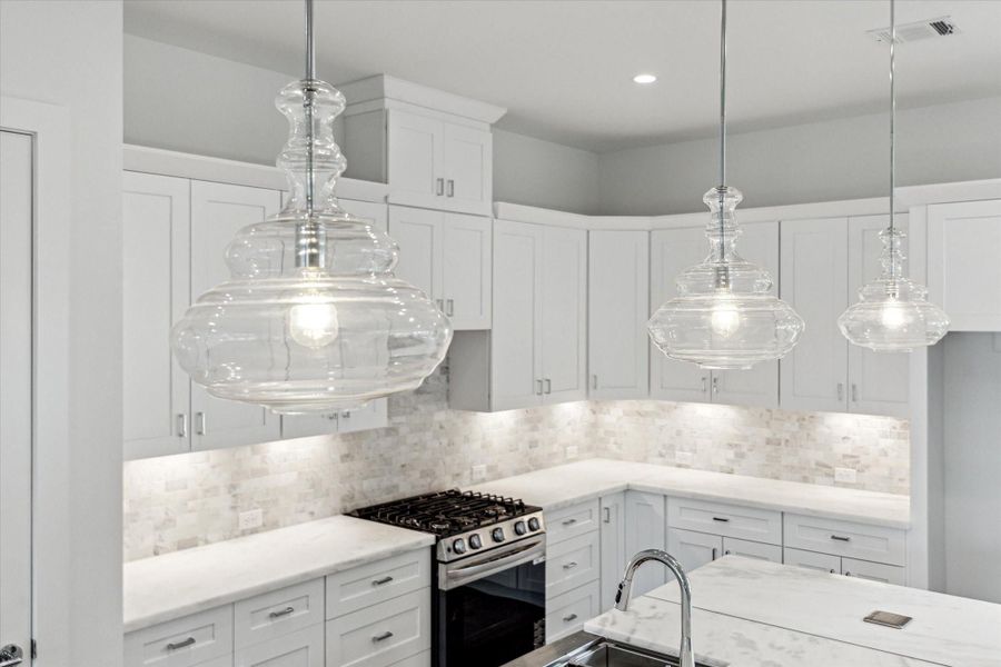 Designer Lighting Above the Island.