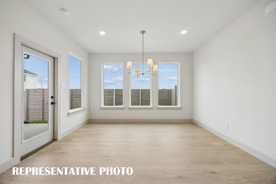 This light and bright dining room is the perfect place for lively dinner parties or cozy family gatherings.  REPRESENTATIVE PHOTO