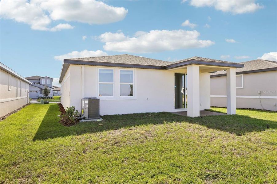 Exterior details and patio area of a home in Springs at Lake Alfred - Classic Series, Lake Alfred (Image 21).