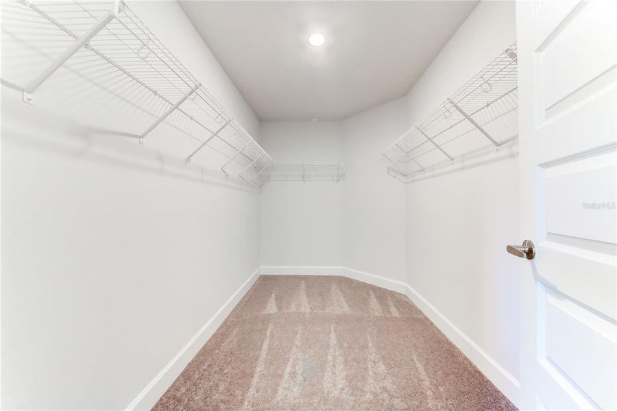 Spacious, unfurnished interior of a new home in Aviary at Rutland Ranch, Parrish (Image 19).