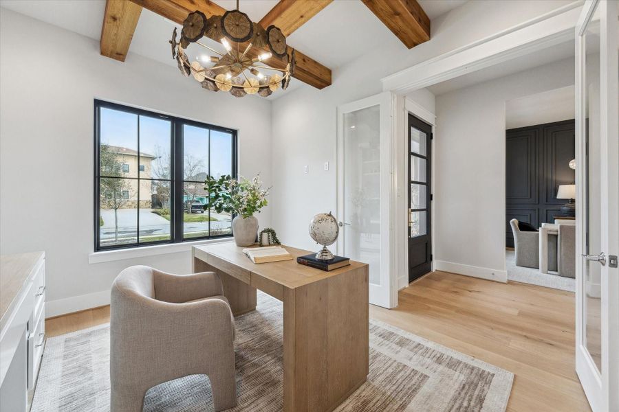 Study located right off of foyer offering unique lighting and wooden beams for extra character.