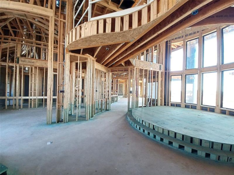 View of the exquisite, elevated Living Room with stacked windows towards the Formal Dining Room, Butler's Pantry, Kitchen and Family Room that's coming along beautifully.