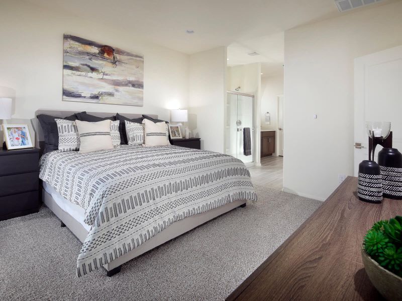 Unwind at the end of the day in the primary suite tucked in the back of the home.