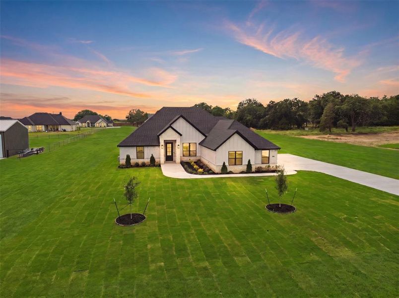 Front exterior of a new home in , Azle, TX, highlighting curb appeal (Image 25). Front exterior of a new home in , Azle, TX, highlighting curb appeal (Image 25).